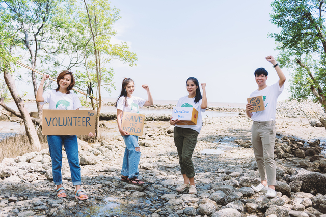 Group of Asian diverse people volunteer holding a speech sign for World Environment Day campaign,Earth Day about pollution,ecosystem,energy and garbage.
